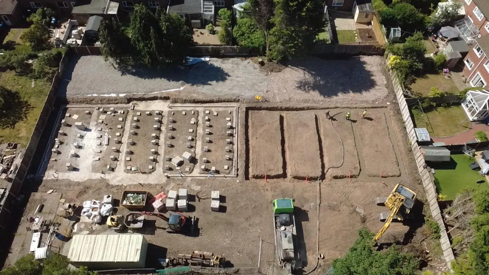 Aerial view of a Stret Limited groundworks site with strip foundations, drainage trenches and block and beam pads set out